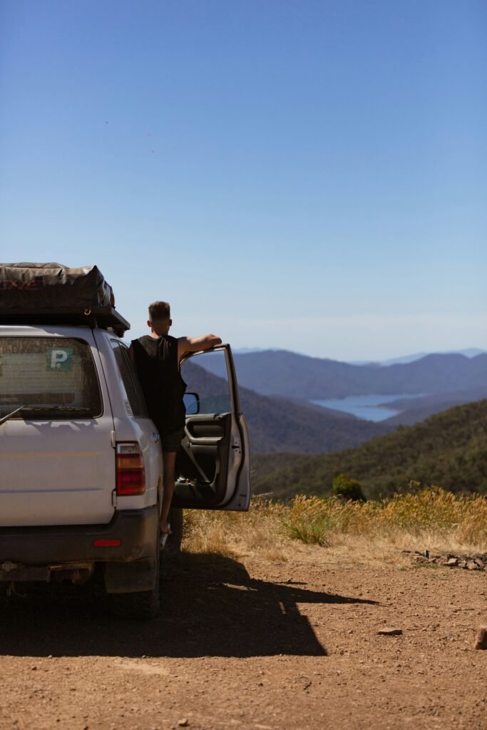 man 4WD overlooking Lake Eildon